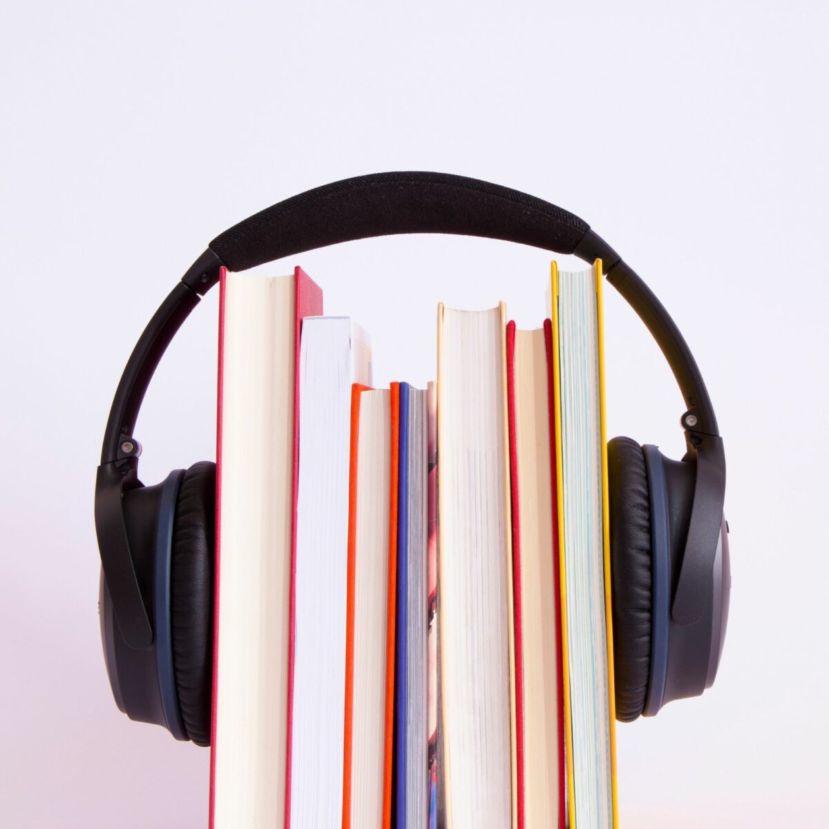 headphones around a set of books